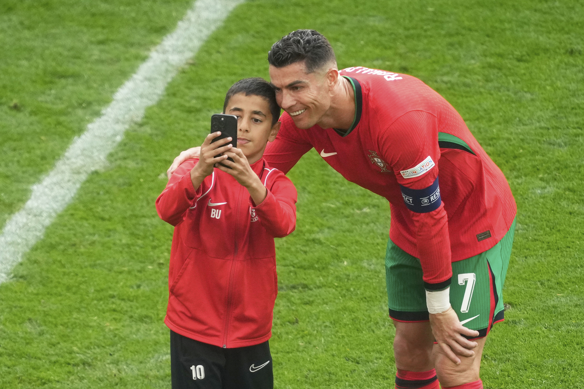 Image: A Child Storms The Field To Take A Selfie With Ronaldo